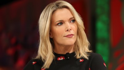 Megyn Kelly sitting wearing black with closed mouth