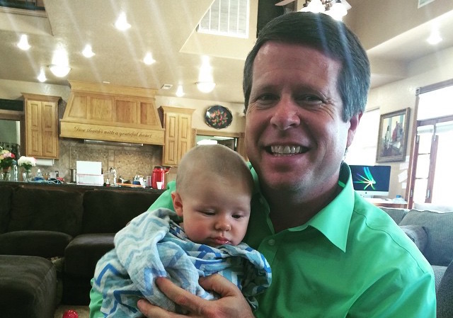 Jim Bob Duggar Holds Baby Grandchild At Home