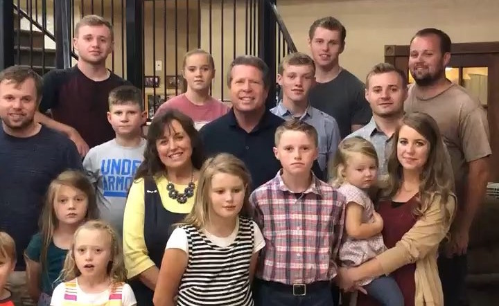 Duggars Standing And Smiling On Staircase