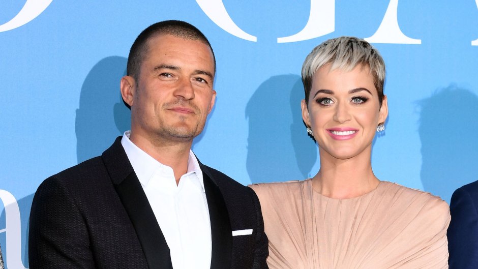 Katy Perry, dressed in pink with Orlando Bloom