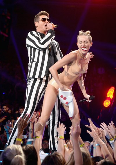 Miley Cyrus twerks on top of Robin Thicke at the 2013 VMAs