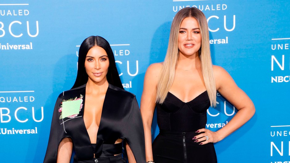Kim and Khloe Kardashian wearing all black at an event