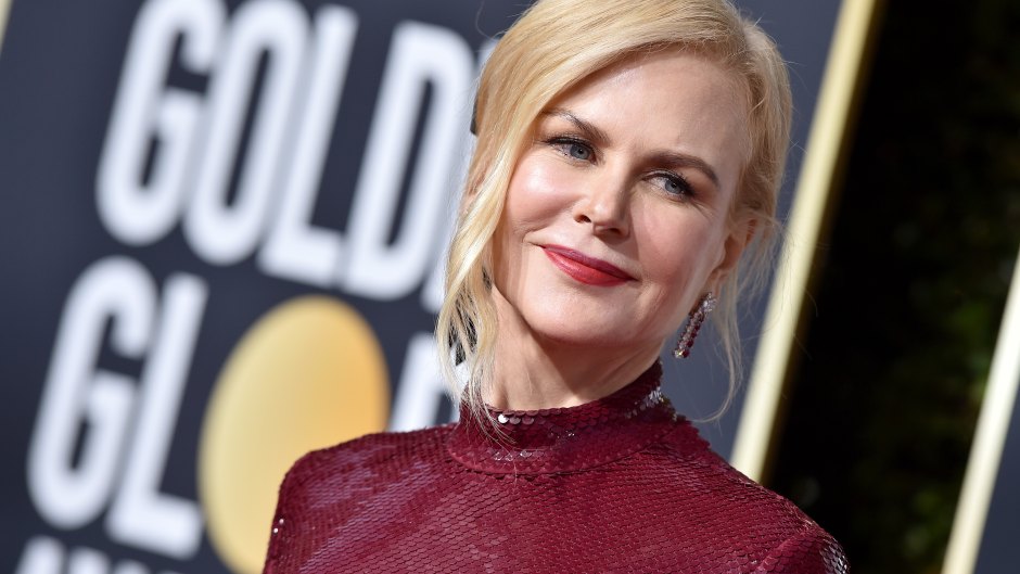 Upclose picture of Nicole Kidman on the Golden Globes red carpet wearing a maroon dress