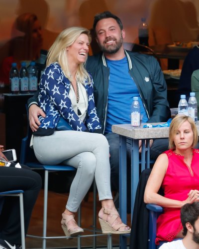 Ben Affleck and Lindsay Shookus laughing and sitting down