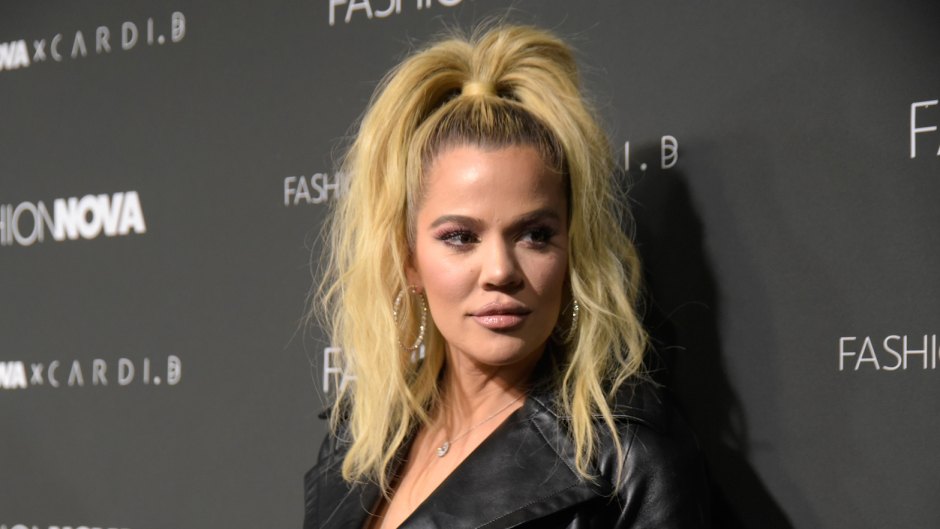 Khloe Kardashian wearing a high ponytail with a black outfit