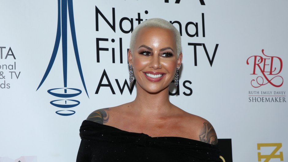 Amber Rose wearing a black dress at an event