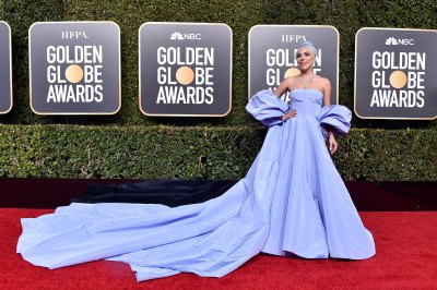 Lady Gaga wearing a huge purple dress at the Golden Globes