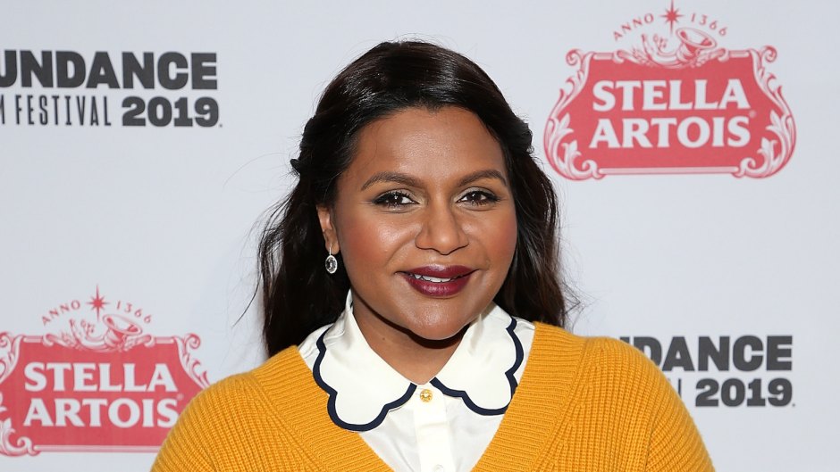 Mindy Kaling wearing a yellow sweater at an event