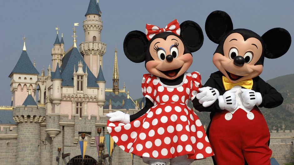 Mickey and Minnie Mouse are seen in front of the Sleeping Beauty Castle at the new Disneyland Park on September 1, 2005 in Hong Kong.