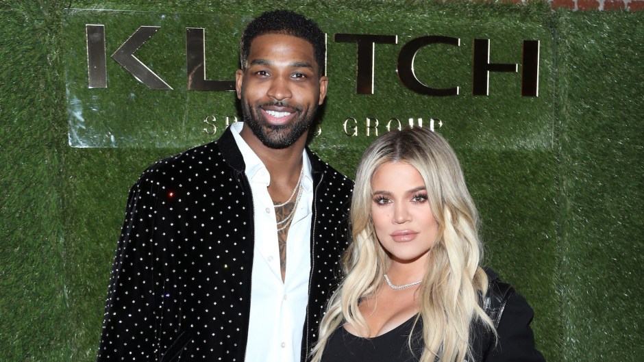 Khloe Kardashian wearing a black outfit with Tristan Thompson