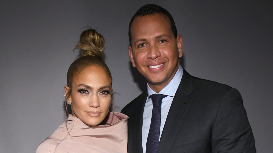 J.Lo with a top knot with Alex Rodriguez wearing a suit