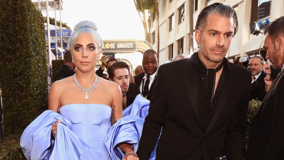 Lady Gaga holding hands with Christian Carino at the Globes