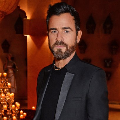 Justin Theroux wearing a black suit at an event