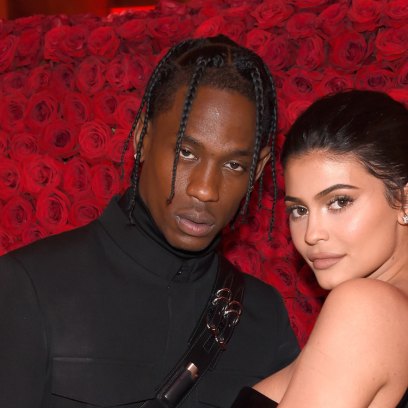 Kylie Jenner and Travis Scott with a rose flower background