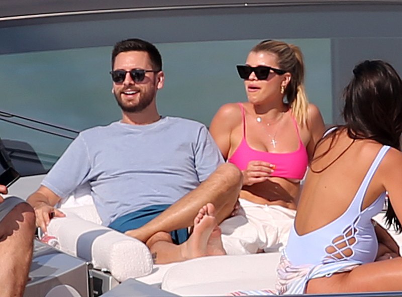 EXCLUSIVE: Model Sofia Richie wears a hot pink bikini top as she relaxes on a yacht with boyfriend Scott Disick in Miami at the miami yacht show