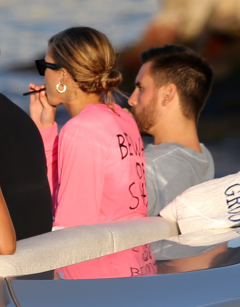 EXCLUSIVE: Model Sofia Richie wears a hot pink bikini top and later a "Groot" shirt as she relaxes on a yacht with boyfriend Scott Disick in Miami at the miami yacht show