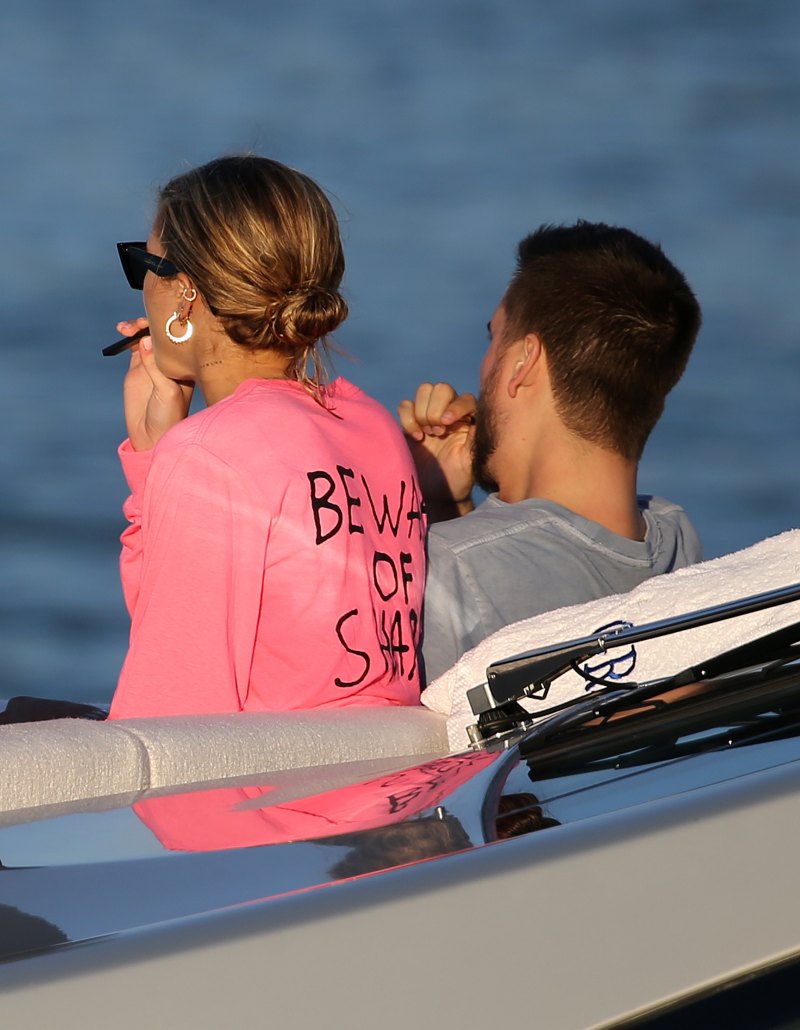 EXCLUSIVE: Model Sofia Richie wears a hot pink bikini top and later a "Groot" shirt as she relaxes on a yacht with boyfriend Scott Disick in Miami at the miami yacht show