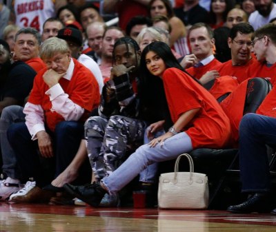 Kylie Jenner wearing red with Travis Scott