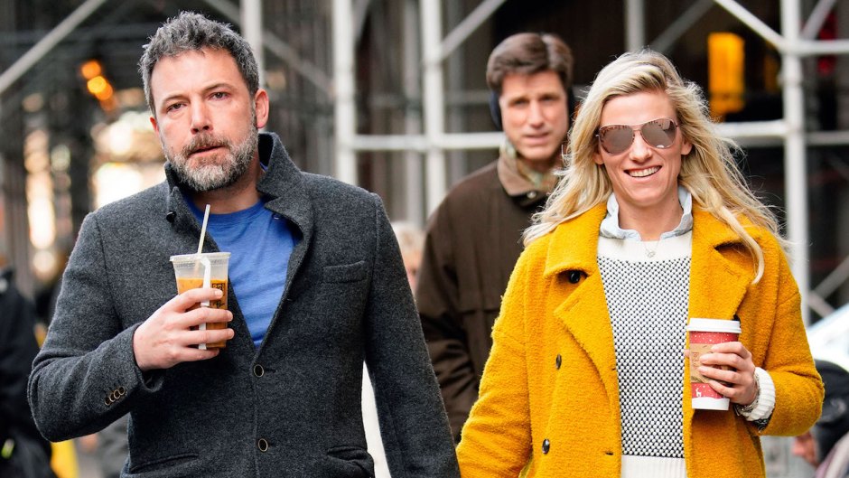 Ben Affleck holding hands with Lindsay Shookus in a yellow coat