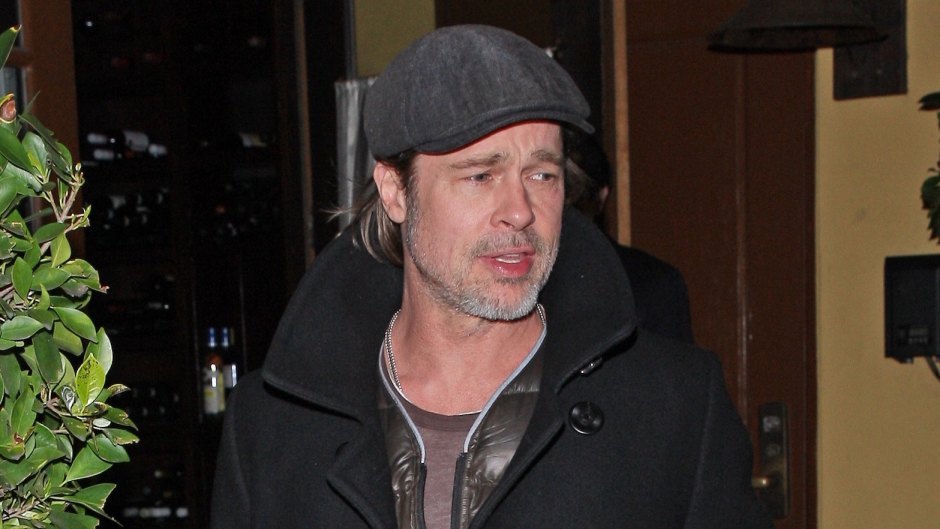 Brad Pitt wearing a hat and jacket