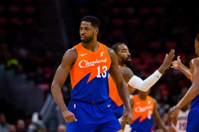 tristan thompson wearing an orange and blue jersey