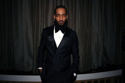 nipsey hussle wearing a suit at an event