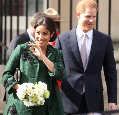 prince harry with meghan markle wearing a green dress