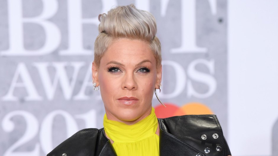 pink wearing a yellow dress with a leather jacket