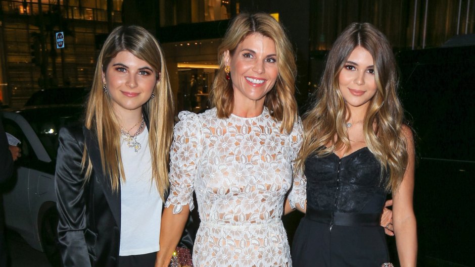 lori loughlin wearing a lace dress with her daughters