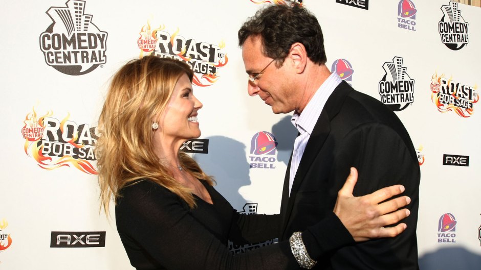 bob saget wearing a suit hugging lori loughlin in a black outfit