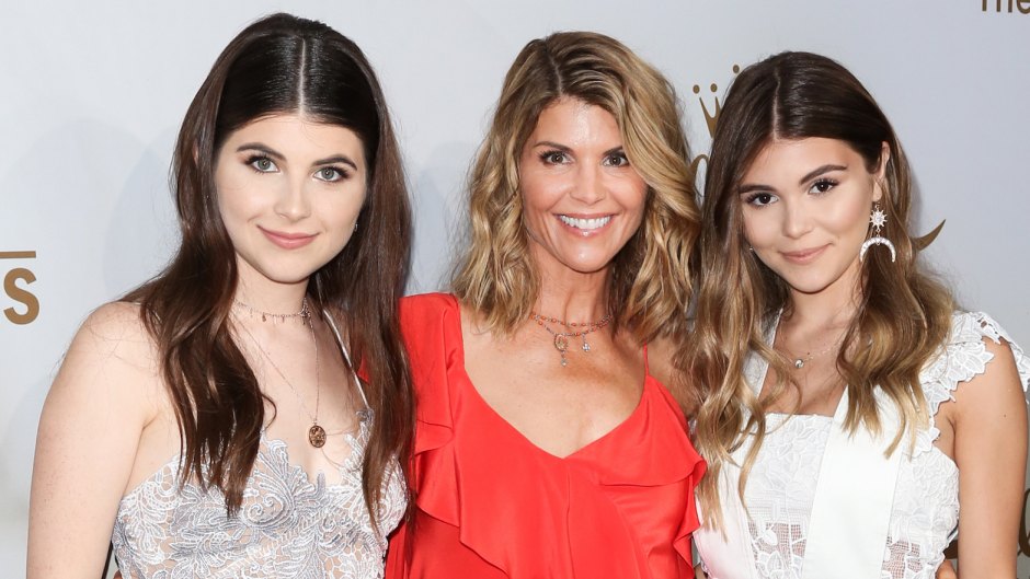 lori loughlin in a red dress with her two daughters