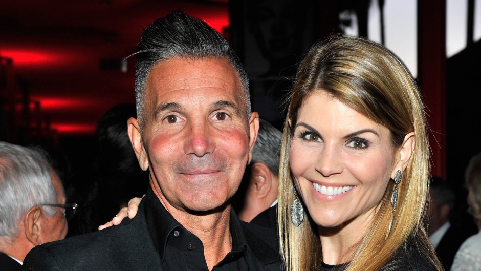 Lori Loughlin with her husband Mossimo at an event wearing black