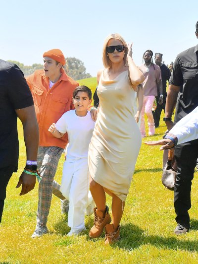 Khloe Kardashian Wearing Sunglasses And Wearing a White Dress