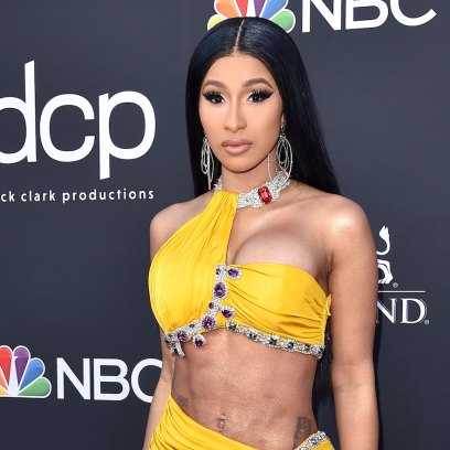 Cardi B Wearing a Yellow Dress With Her Abs Sticking Out at Event