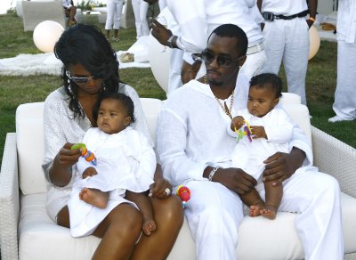 Diddy With Kim Porter And Their Kids Wearing All White