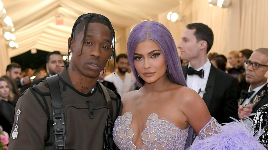 Kylie Jenner Travis Scott met gala 2019 purple hair outfits purple feathered dress military suit