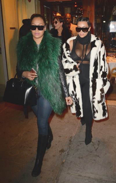 Kim Kardashian Wearing a Huge Black and White coat With La La Antony in a Green Jacket