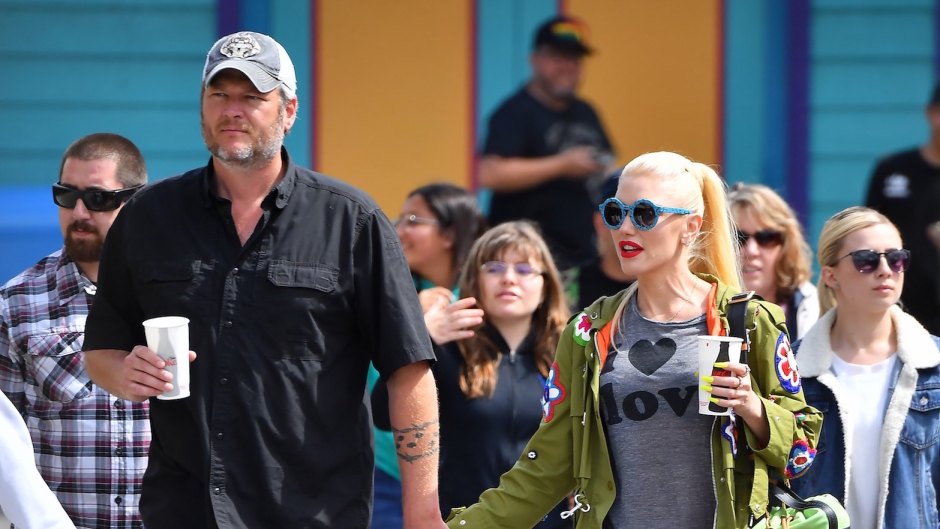 Blake Shelton Wearing a Black Shirt Holding Hands with Gwen Stefani in Blue Sunglasses