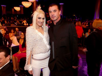 Gwen Stefani Wearing White With Gavin Rossdale in a Black Outfit