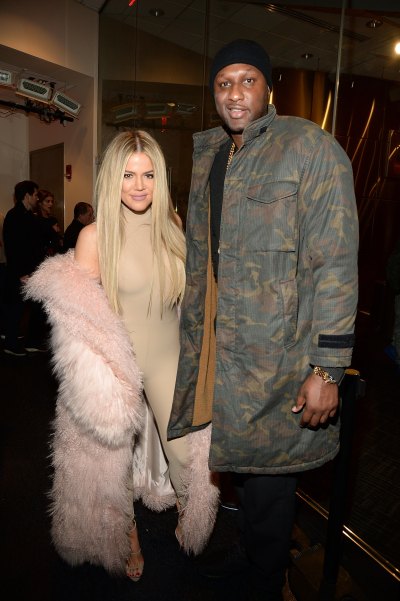 Khloe Kardashian Wearing a Pink Outfit with Lamar Odom in a Army Jacket