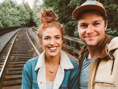 Jeremy Roloff and Audrey Roloff Stand On Train Tracks