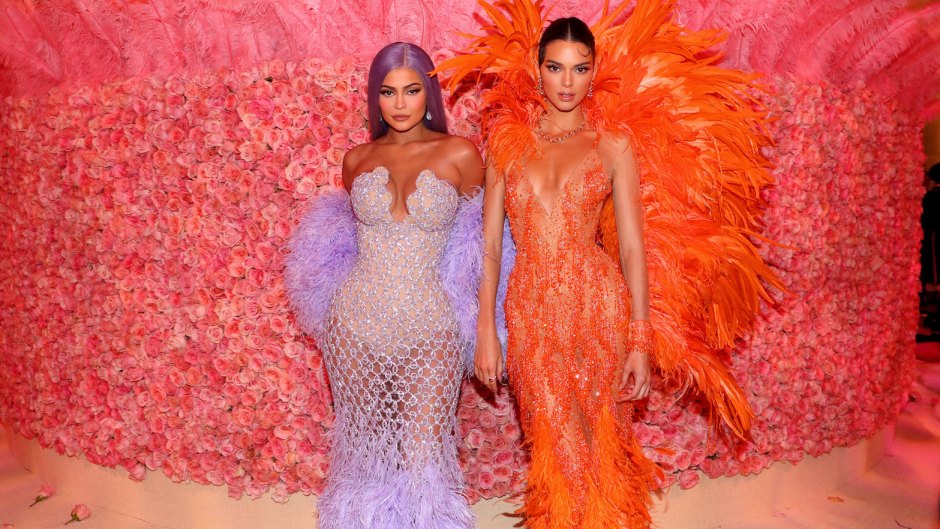 Kylie Jenner Wearing a Purple Dress With Kendall Jenner Wearing an Orange Dress