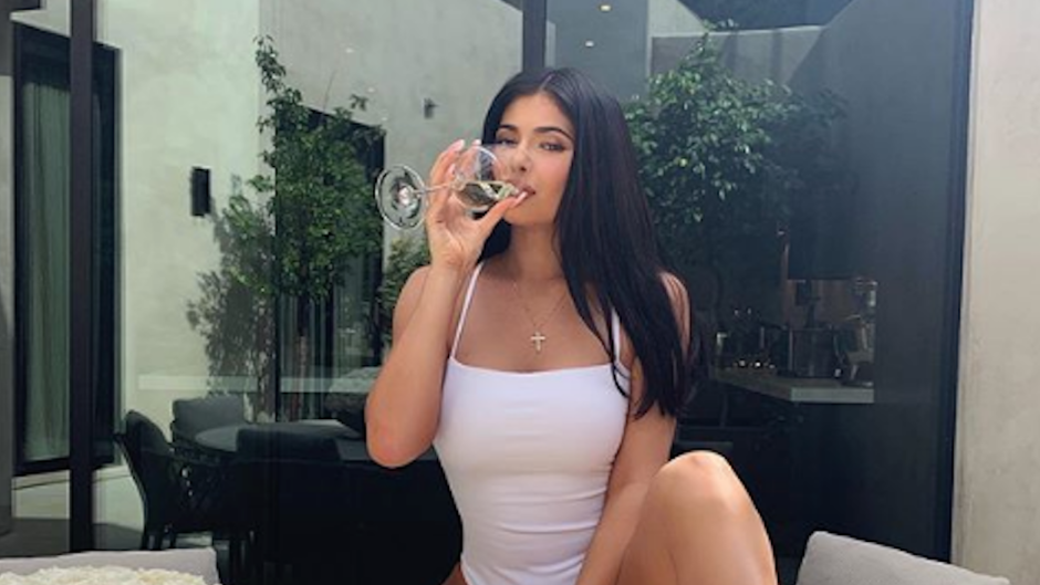 Kylie Jenner Wearing White and Drinking Wine