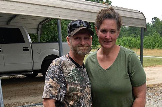 Mike Sugar Bear Thompson Wears Camo Shirt And Smiles With Wife Jennifer Lamb In Olive Green Top
