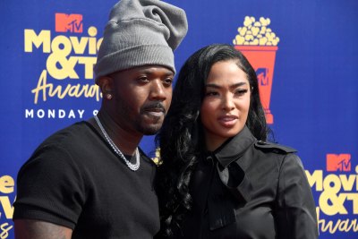 Princess Love Wearing All Black With Her Husband Ray J Wearing a Gray Beanie at the MTV Movie Awards