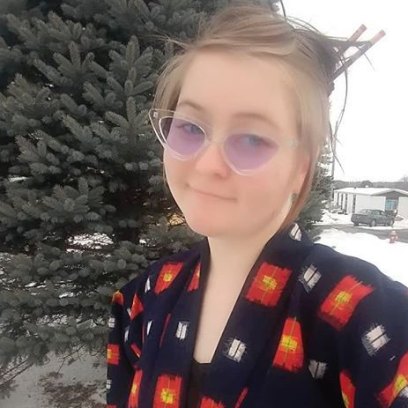 Tasha Rosenbrook Wears Black Kimono with Red and White Markings Outside in the Snow