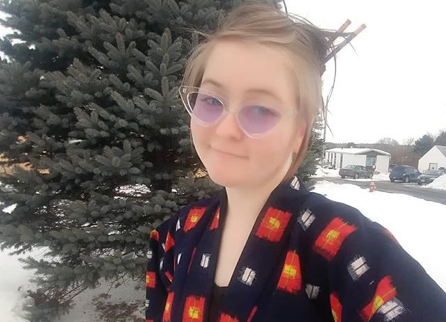 Tasha Rosenbrook Wears Black Kimono with Red and White Markings Outside in the Snow