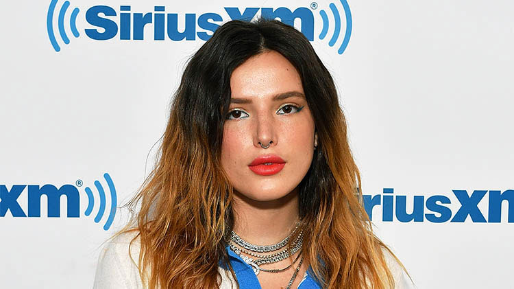 bella thorne wears red lipstick a white top and several silver necklaces bella thorne nude photo hack