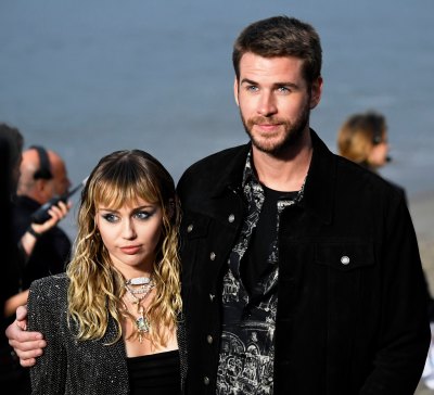 Miley Cyrus and Liam Hemsworth Arm in Arm at Fashion Show Relationship Marriage