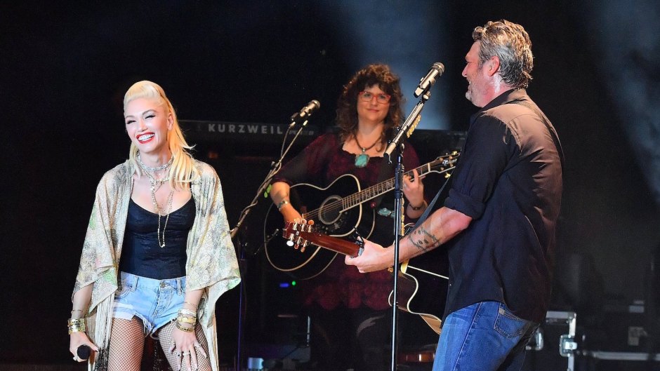 Gwen Stefani Wearing Jean Shorts With a Black Top on Stage with Blake Shelton With His Guitar